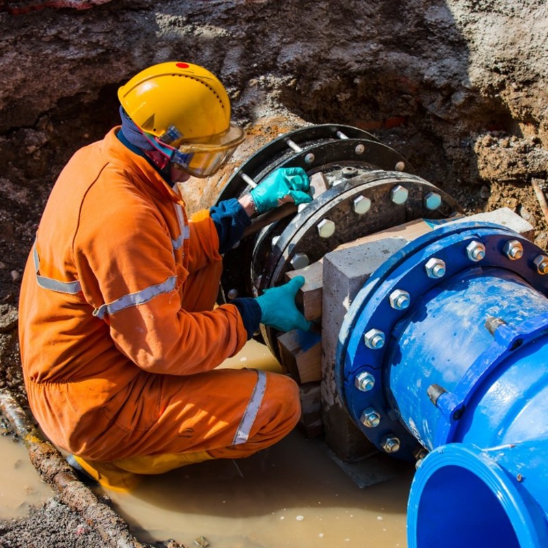 Leak Detection Engineer repairs major water pipe